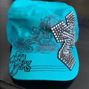 Hat, Teal & Black color hat w/black color cross on the side.